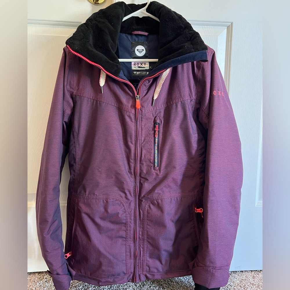 Roxy ladies size Medium burgundy with orange and rainbow trim zippers.